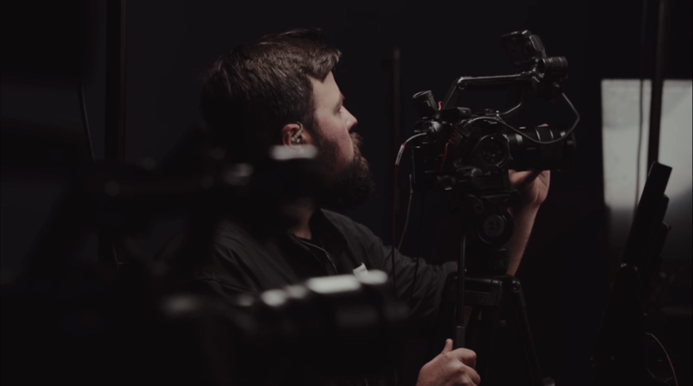 Arron operating a cinema camera during the studio production